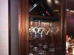 Close Up Of Adjustable Wine Glass Rack Sets Mounted Below Wine Racks